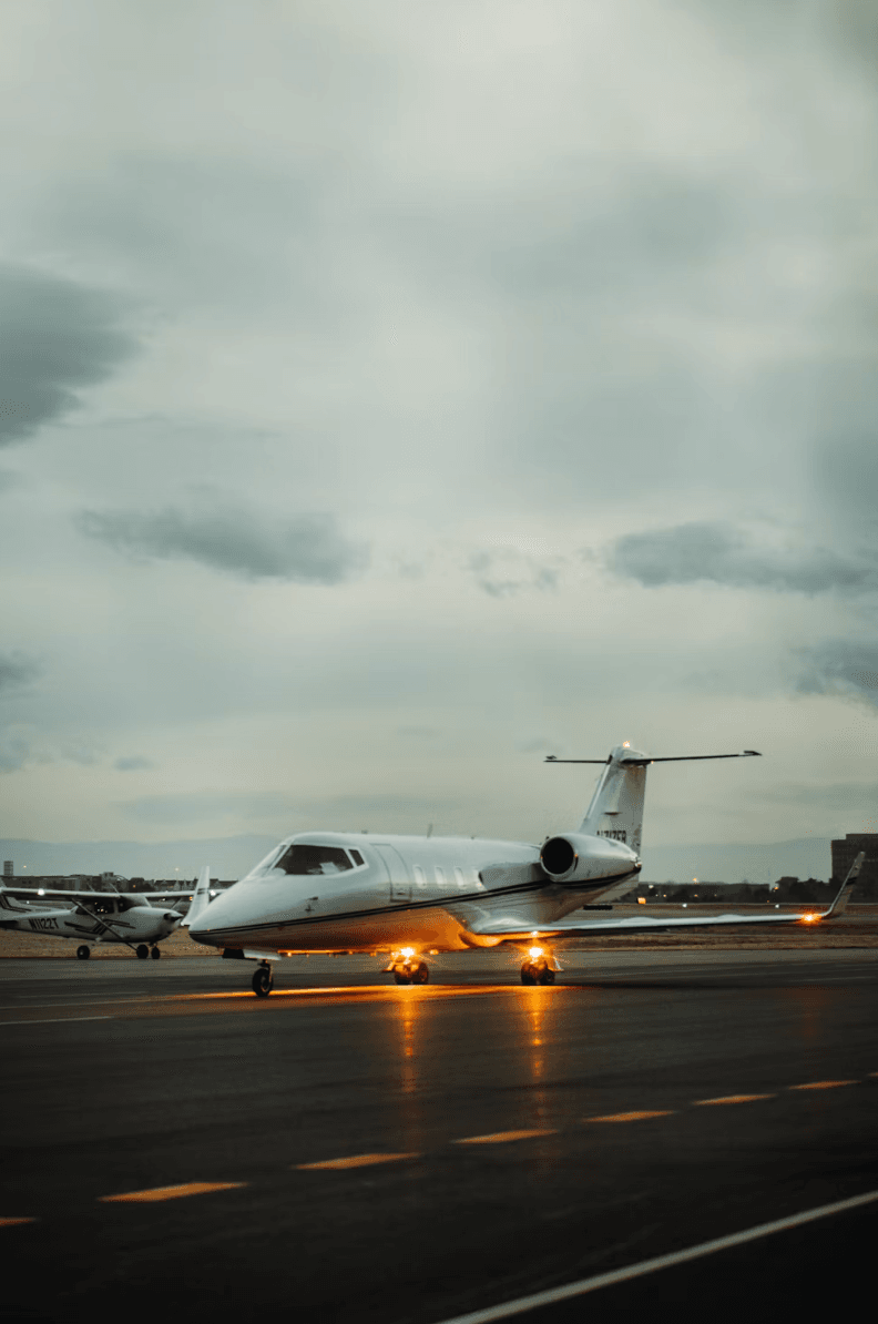 Private jet on a runway at dusk